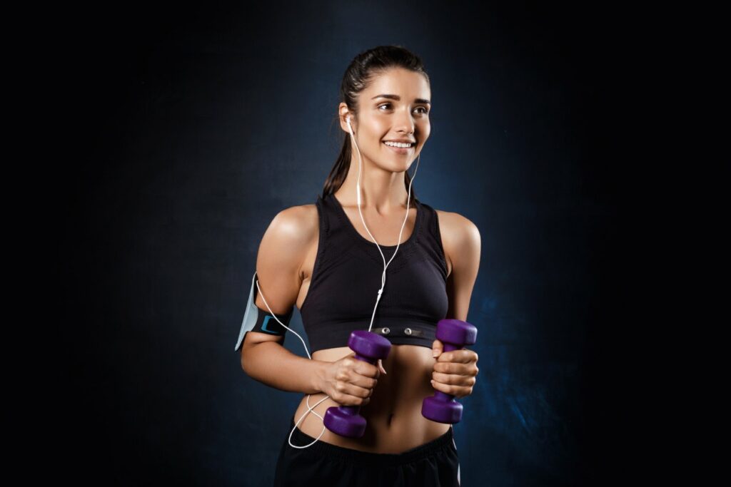 Woman lifting dumbbells